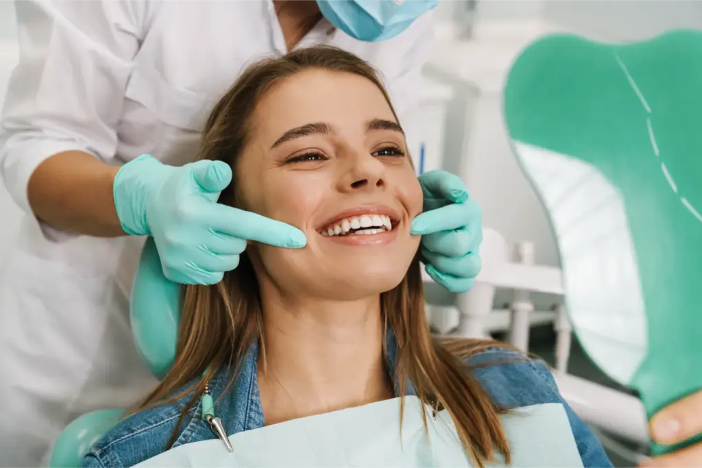 Female patient smiling during dental checkup appointment