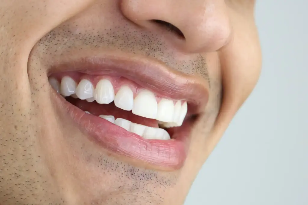 Close up male smile with white healthy teeth