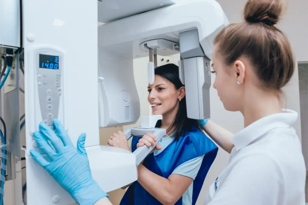 Dentist consulting male patient during dental visit