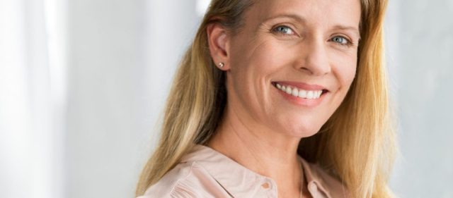 woman smiling at the dentist
